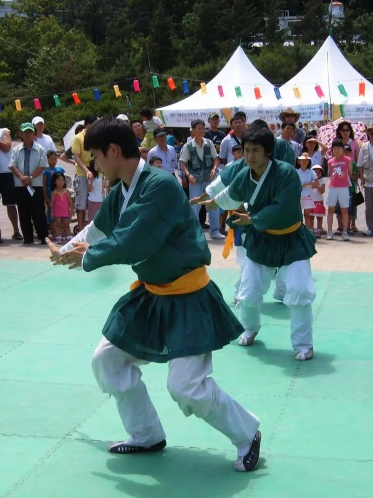 Wikimedia Commons photograph of Korean taekkyeon practitioners performing a traditional martial art