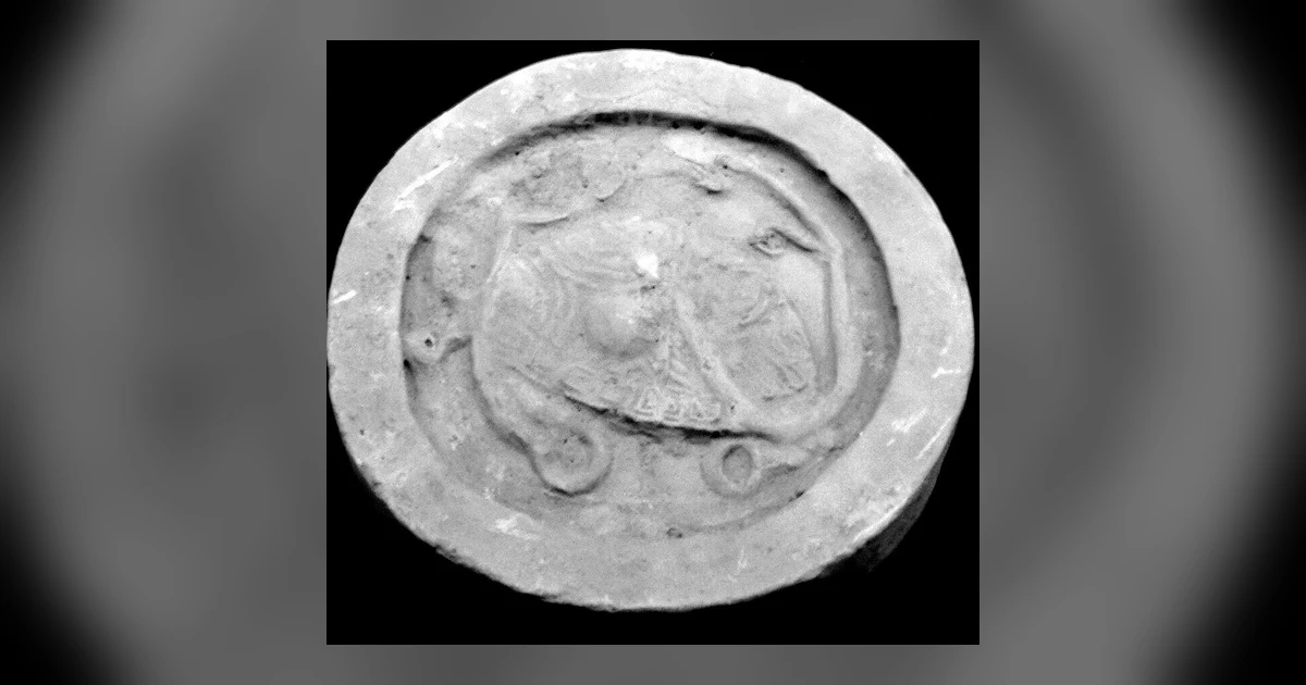 Ancient Chinese wadang roof-tile relief depicting Xuanwu as a coiled tortoise and snake